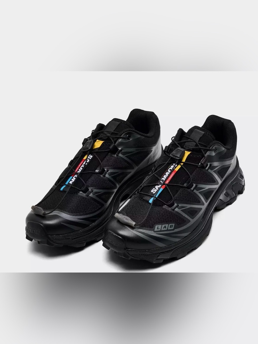 Salomon Black Trail Shoes with Blue, Yellow and Red Details